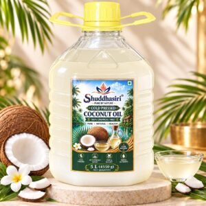 Shuddhasiri wood-pressed coconut oil bottles with fresh coconuts